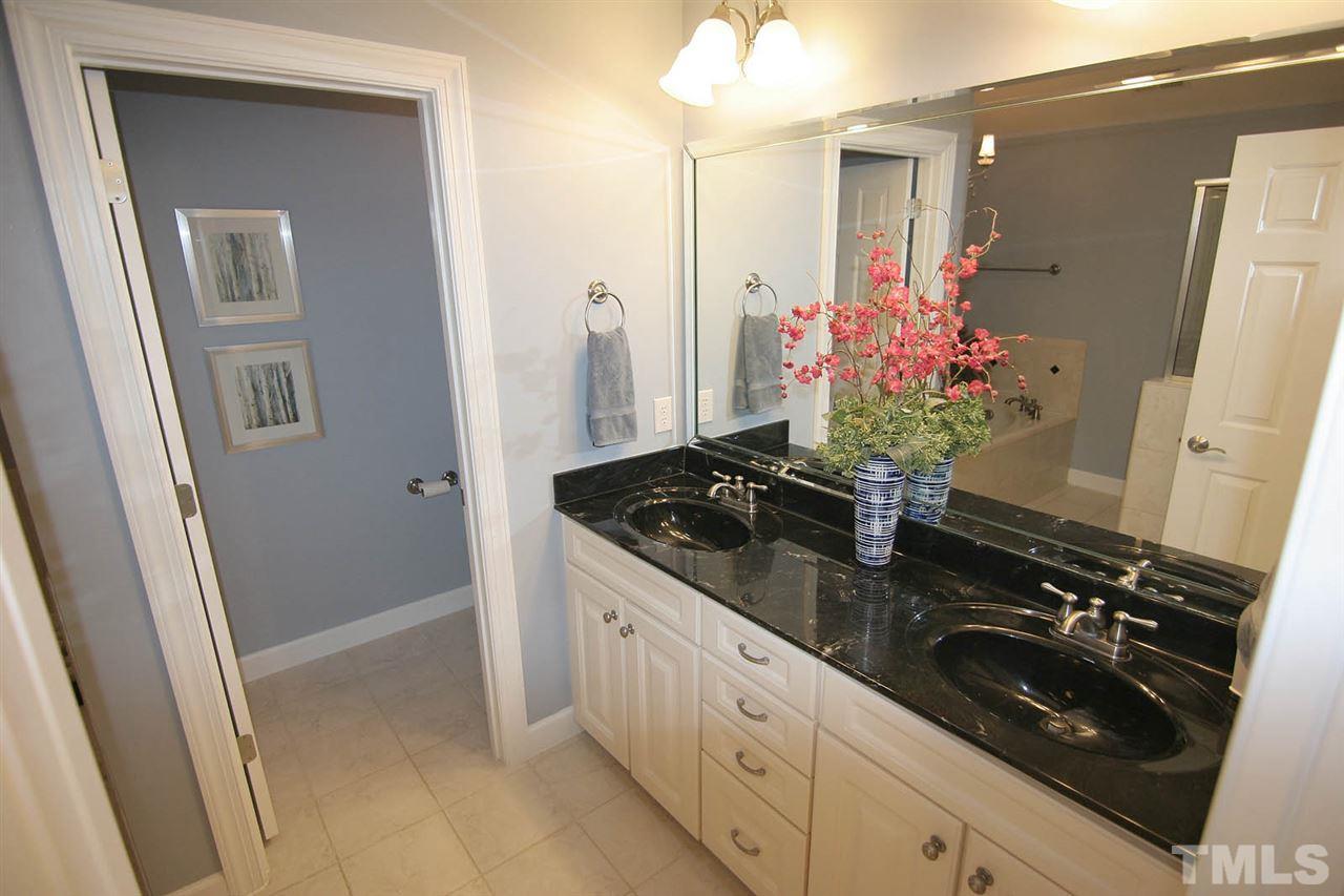 7334 Fontana Ridge Lane Raleigh, NC 27613 - Photo 15 of 24 a kitchen with a sink stove and refrigerator