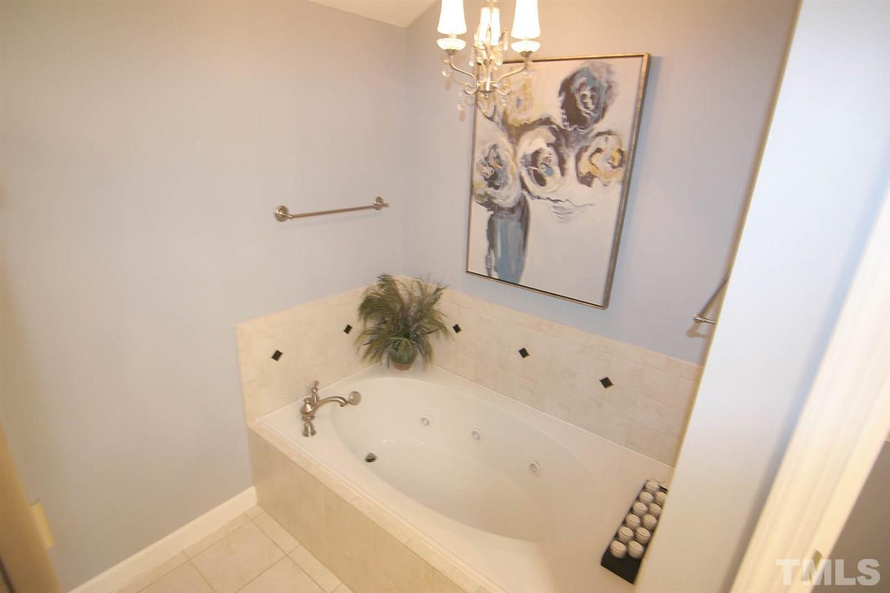 7334 Fontana Ridge Lane Raleigh, NC 27613 - Photo 17 of 24 a bathroom with a bathtub and shower