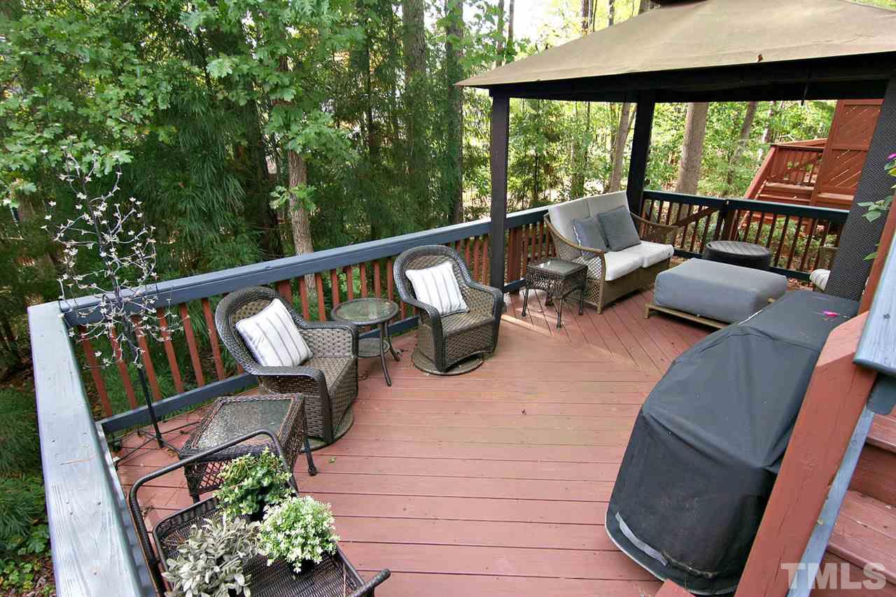 7334 Fontana Ridge Lane Raleigh, NC 27613 - Photo 23 of 24 a balcony with outdoor seating and plants