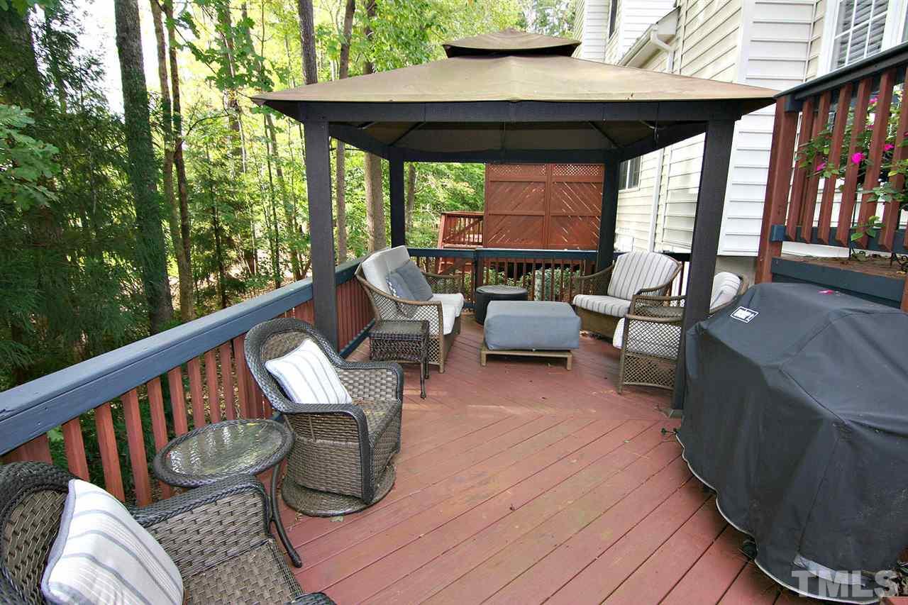 7334 Fontana Ridge Lane Raleigh, NC 27613 - Photo 24 of 24 a balcony with wooden floor and outdoor seating