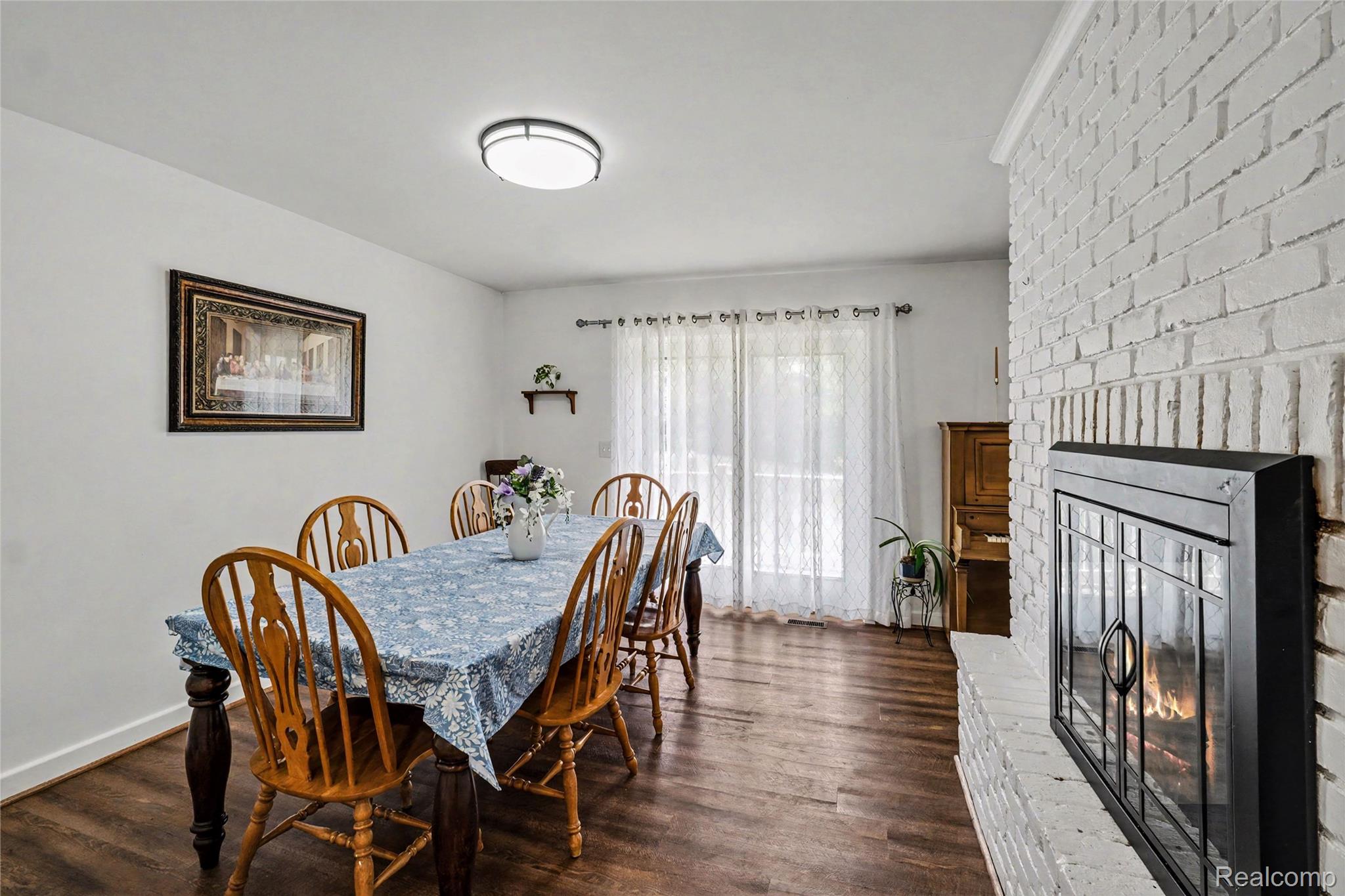 5465 South Lake George Road Metamora, MI 48455 - Photo 17 of 61 Formal dining room with two-way fireplace.