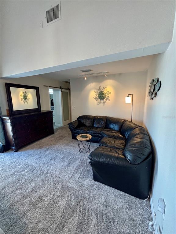 Undisclosed Address Madeira Beach, FL 33708 - Photo 17 of 35 a living room with furniture and a large window