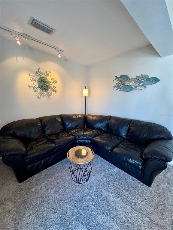 Undisclosed Address Madeira Beach, FL 33708 - Photo 18 of 35 a living room with furniture a couch and wooden floor