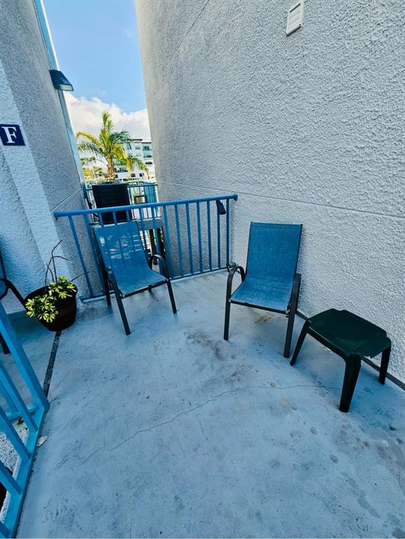 Undisclosed Address Madeira Beach, FL 33708 - Photo 23 of 35 a living room with furniture and a potted plant