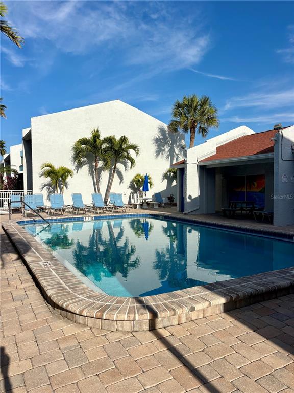 Undisclosed Address Madeira Beach, FL 33708 - Photo 28 of 35 a view of a swimming pool with a yard