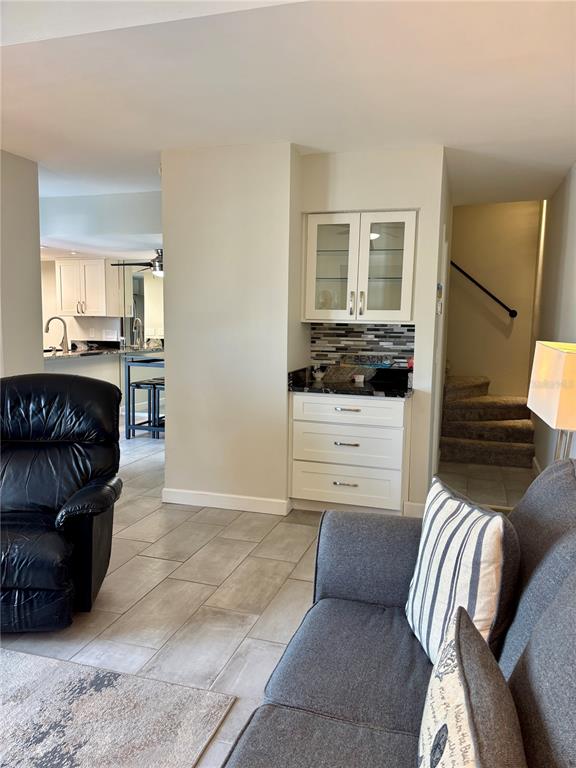 Undisclosed Address Madeira Beach, FL 33708 - Photo 4 of 35 a living room with furniture and a flat screen tv