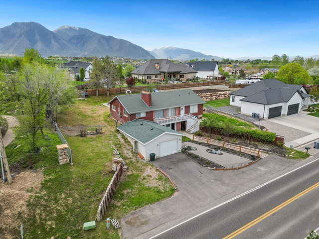 149 West 1600th Street South Mapleton, UT 84664 - Photo 3 of 44 Aerial view of residential area with mountains