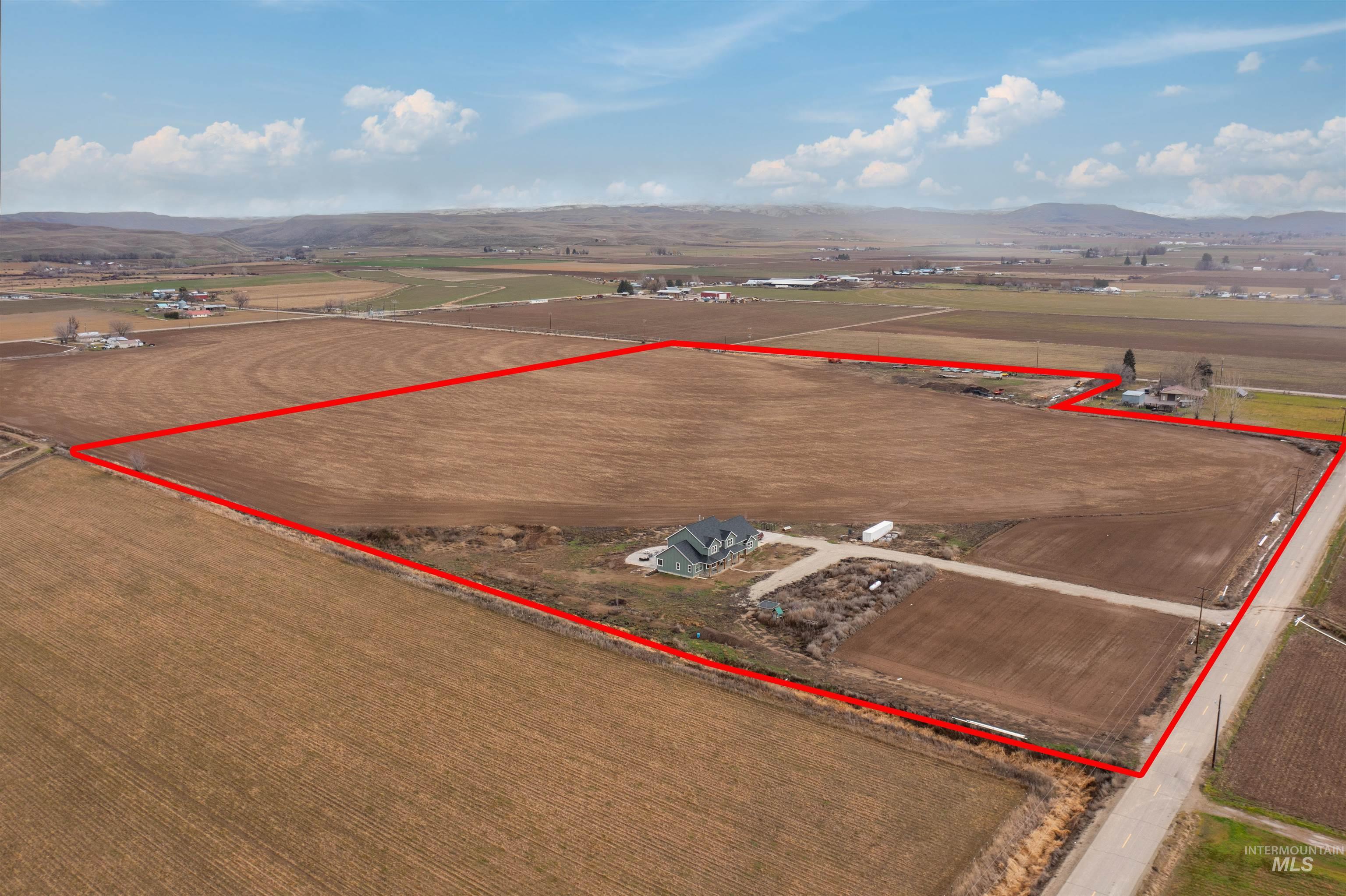 5220 West Central Road Emmett, ID 83617 - Photo 2 of 50 Aerial view of sparsely populated area featuring mountains and property boundaries highlighted
