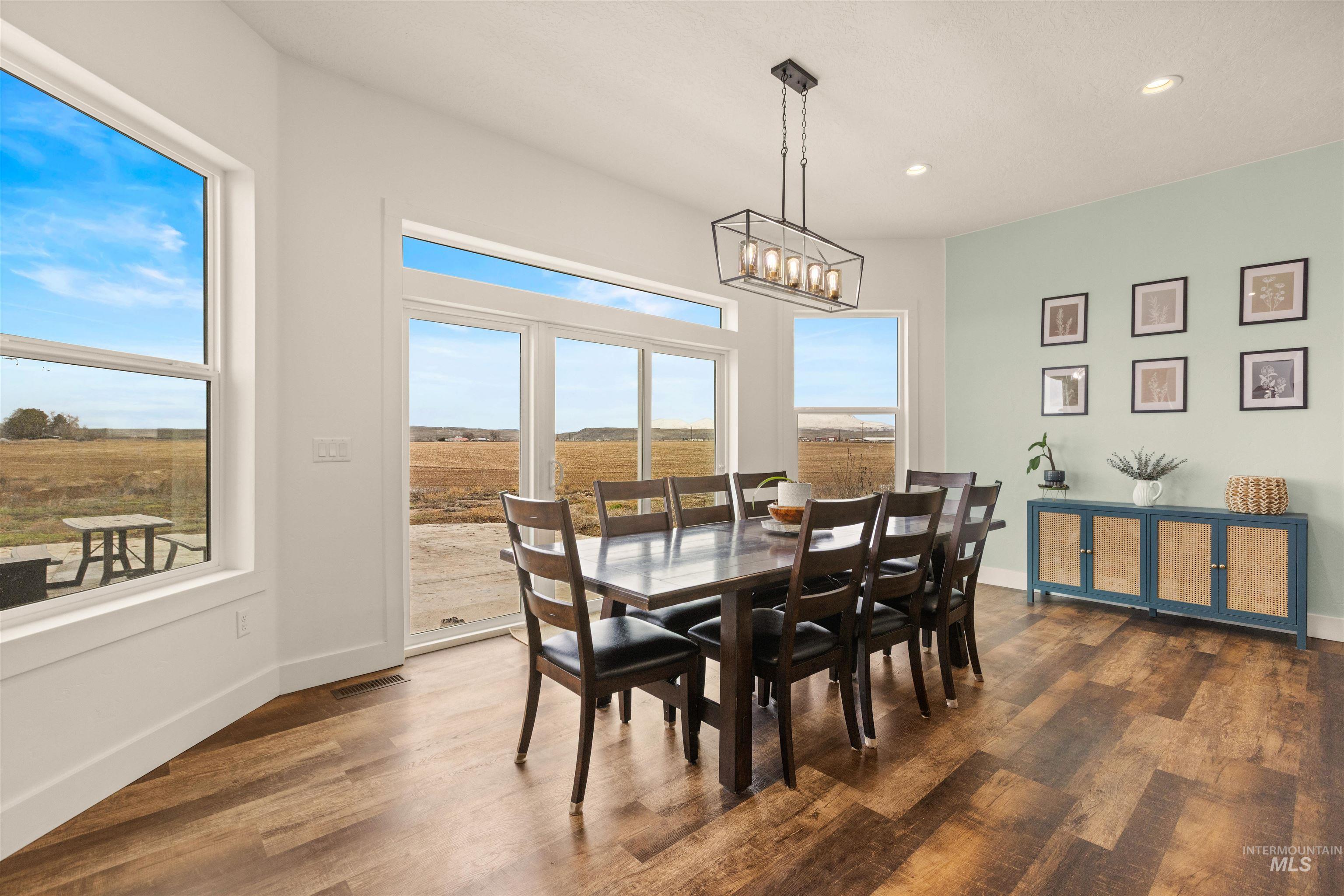 5220 West Central Road Emmett, ID 83617 - Photo 21 of 50 Dining room featuring wood finished floors and suspended lighting