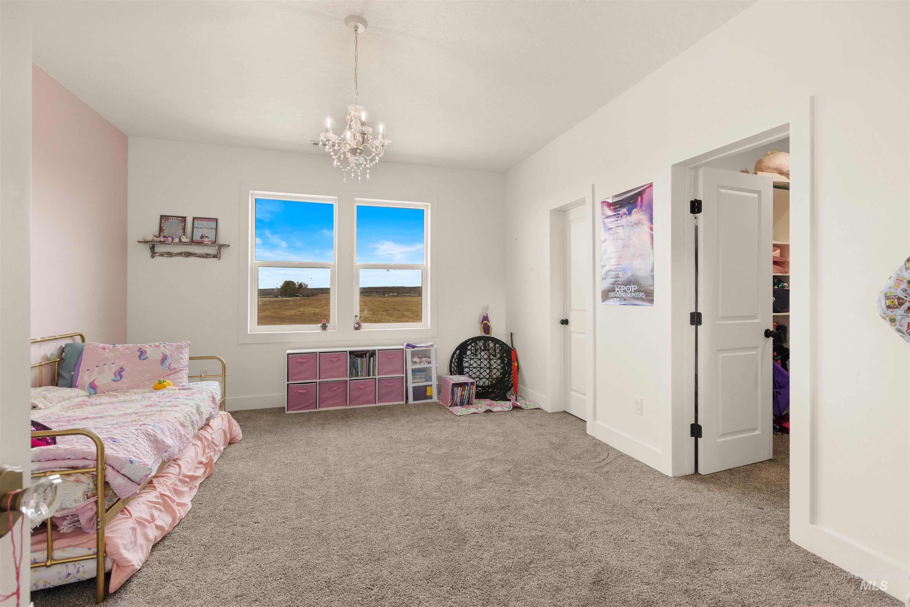 5220 West Central Road Emmett, ID 83617 - Photo 34 of 50 Bedroom with hanging lights and carpet