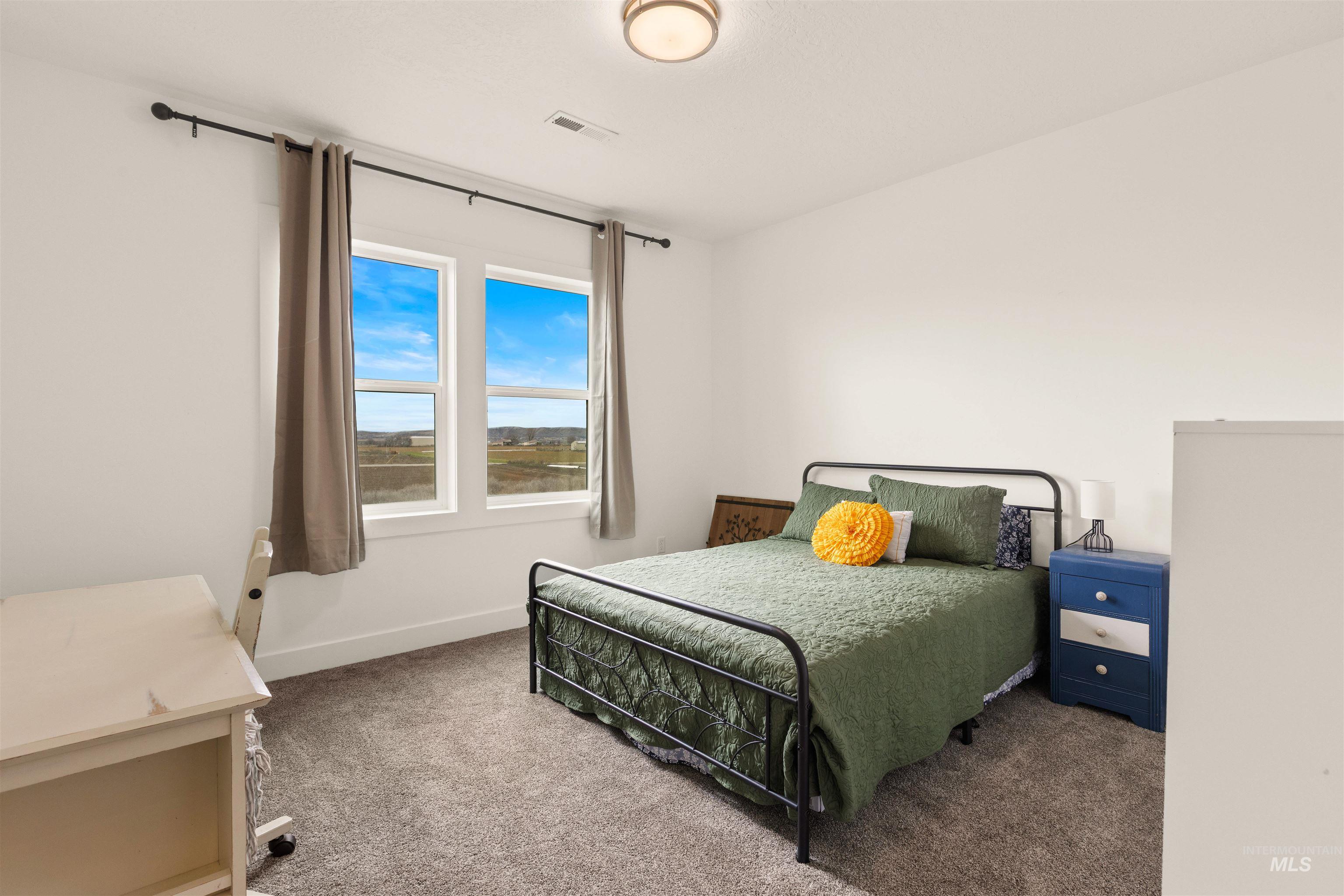 5220 West Central Road Emmett, ID 83617 - Photo 36 of 50 Bedroom with dark carpet and baseboards