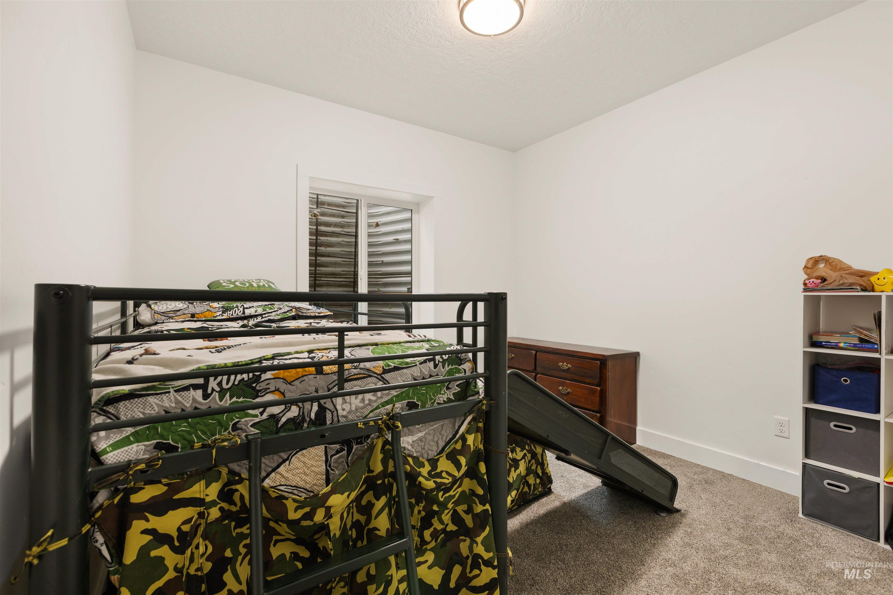 5220 West Central Road Emmett, ID 83617 - Photo 44 of 50 Bedroom featuring light colored carpet and baseboards