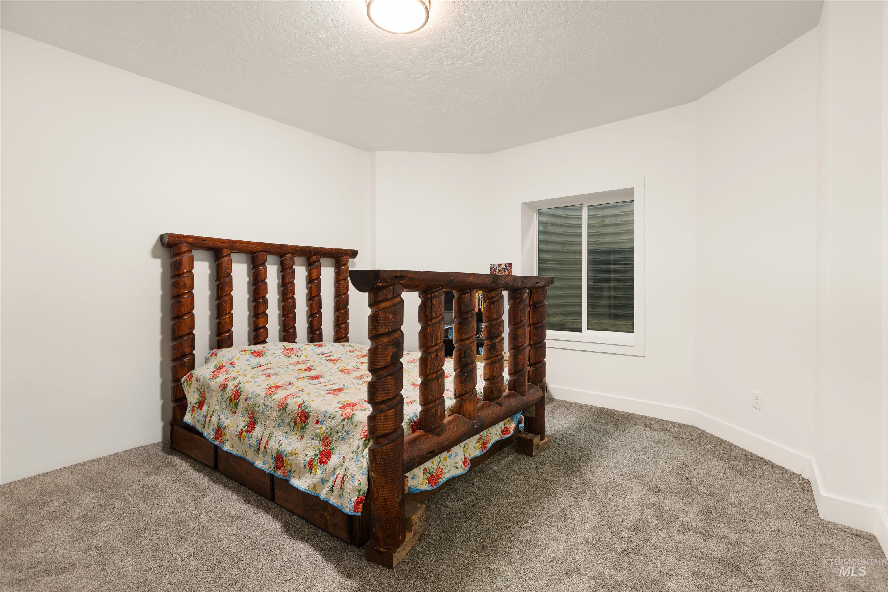 5220 West Central Road Emmett, ID 83617 - Photo 45 of 50 Carpeted bedroom featuring a textured ceiling