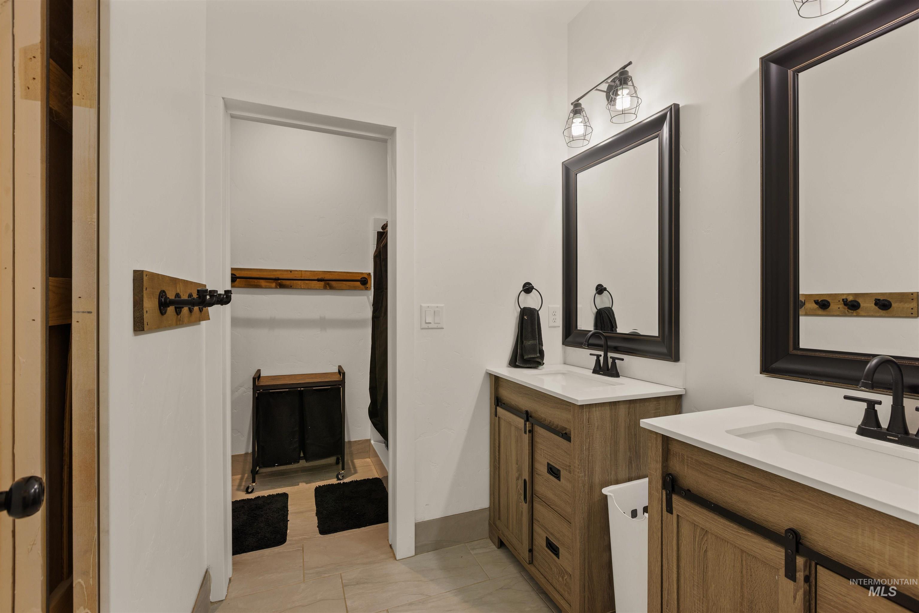 5220 West Central Road Emmett, ID 83617 - Photo 47 of 50 Bathroom with two vanities and a shower stall