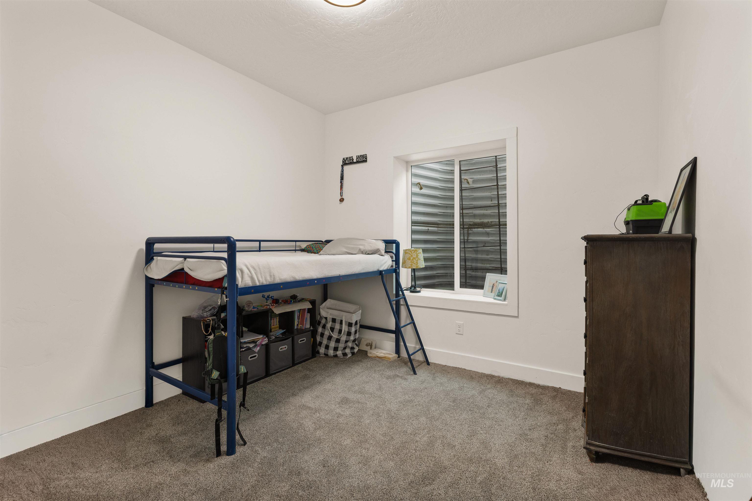 5220 West Central Road Emmett, ID 83617 - Photo 49 of 50 Bedroom featuring light colored carpet and baseboards