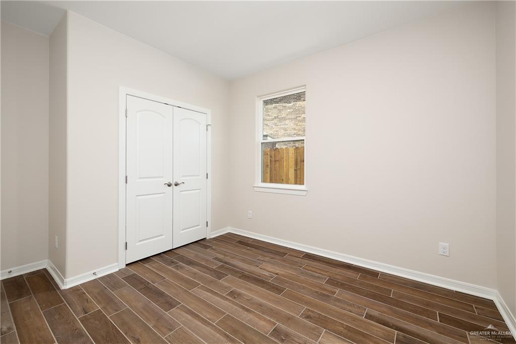 6528 Anaqua Loop McAllen, TX 78504 - Photo 11 of 11 a view of a room with wooden floor and a window