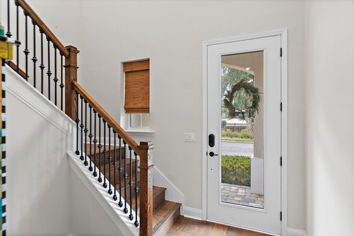 96014 Enclave Manor Fernandina Beach, FL 32034 - Photo 3 of 32 a view of a hallway with wooden floor and entryway