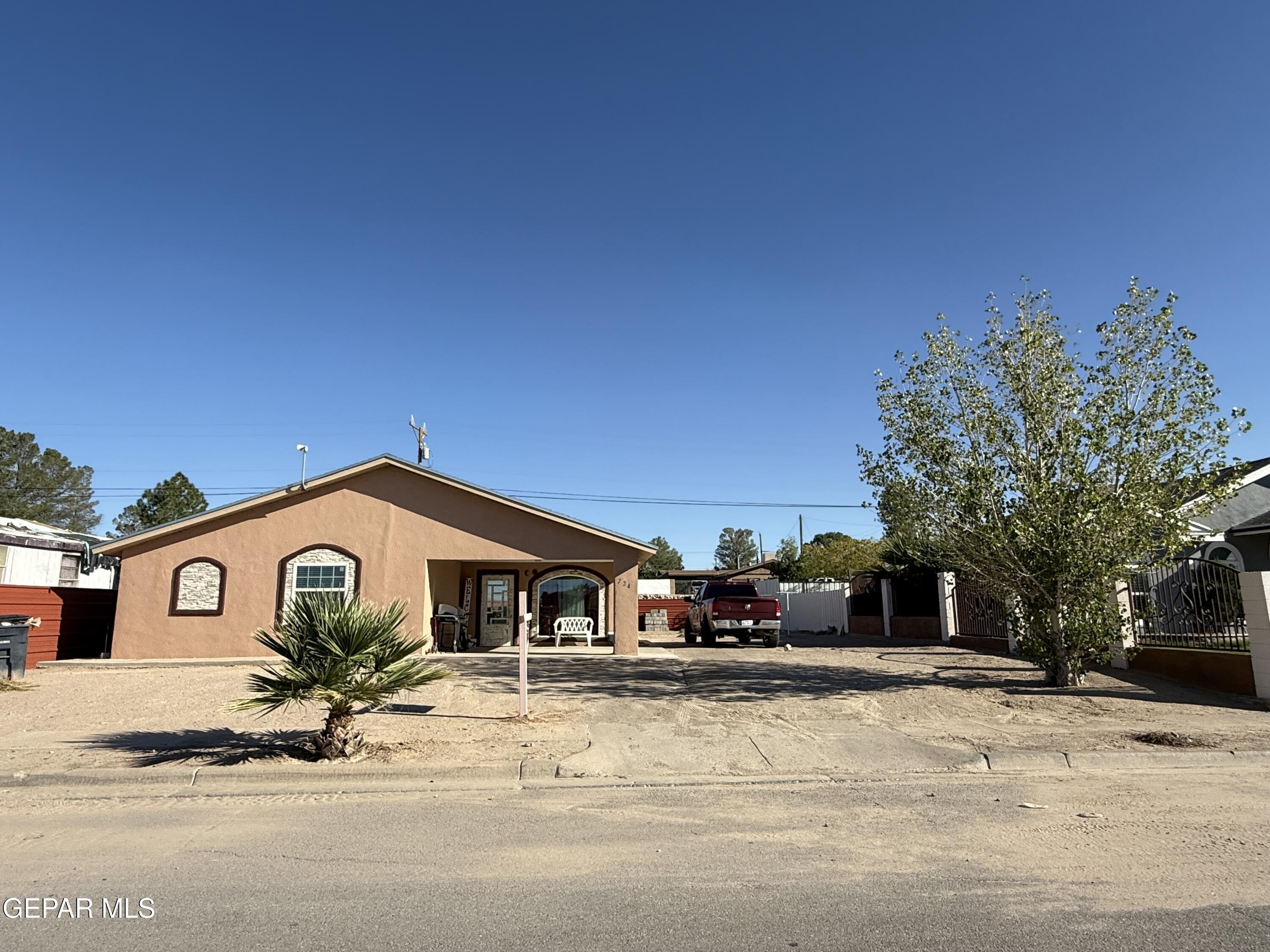 a front view of a house with a outdoor space