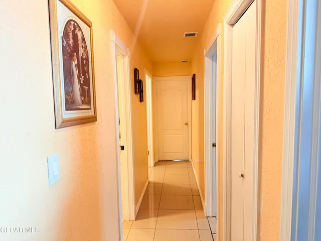 a bedroom with a bed and a mirror