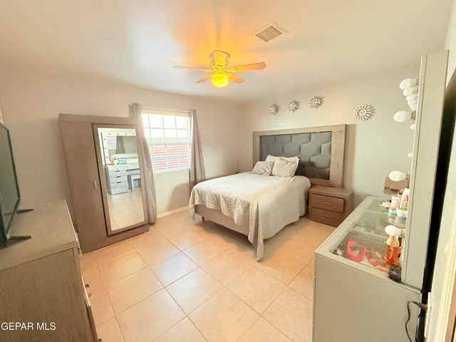 a bedroom with a bed and a cabinets