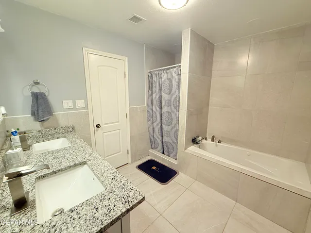 a room with a bed and a mirror