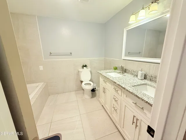 a bed sitting in a room next to a window