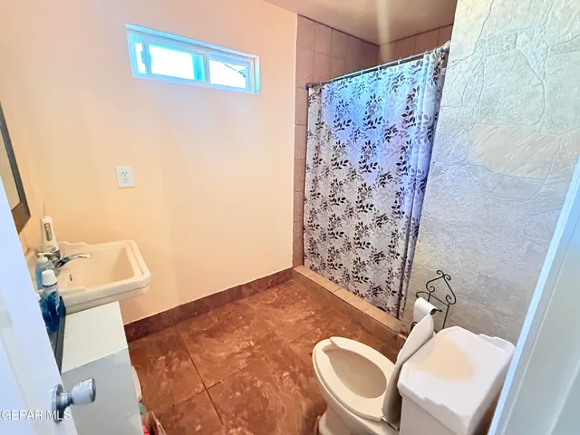 a view of a white house with a outdoor space