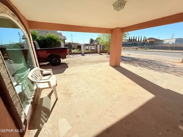 a view of a house with a snow on the road