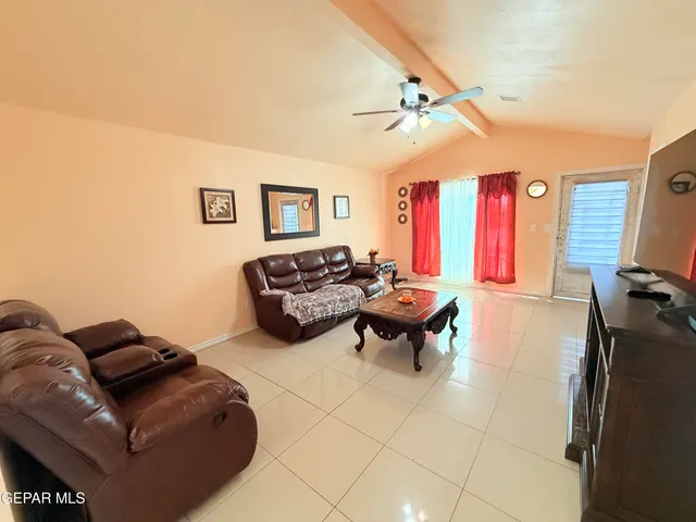 a kitchen with stainless steel appliances a stove refrigerator sink and microwave