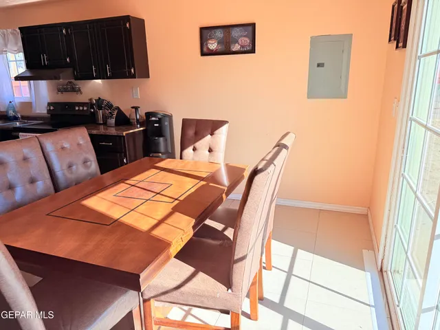 a view of a dining room with furniture and a window