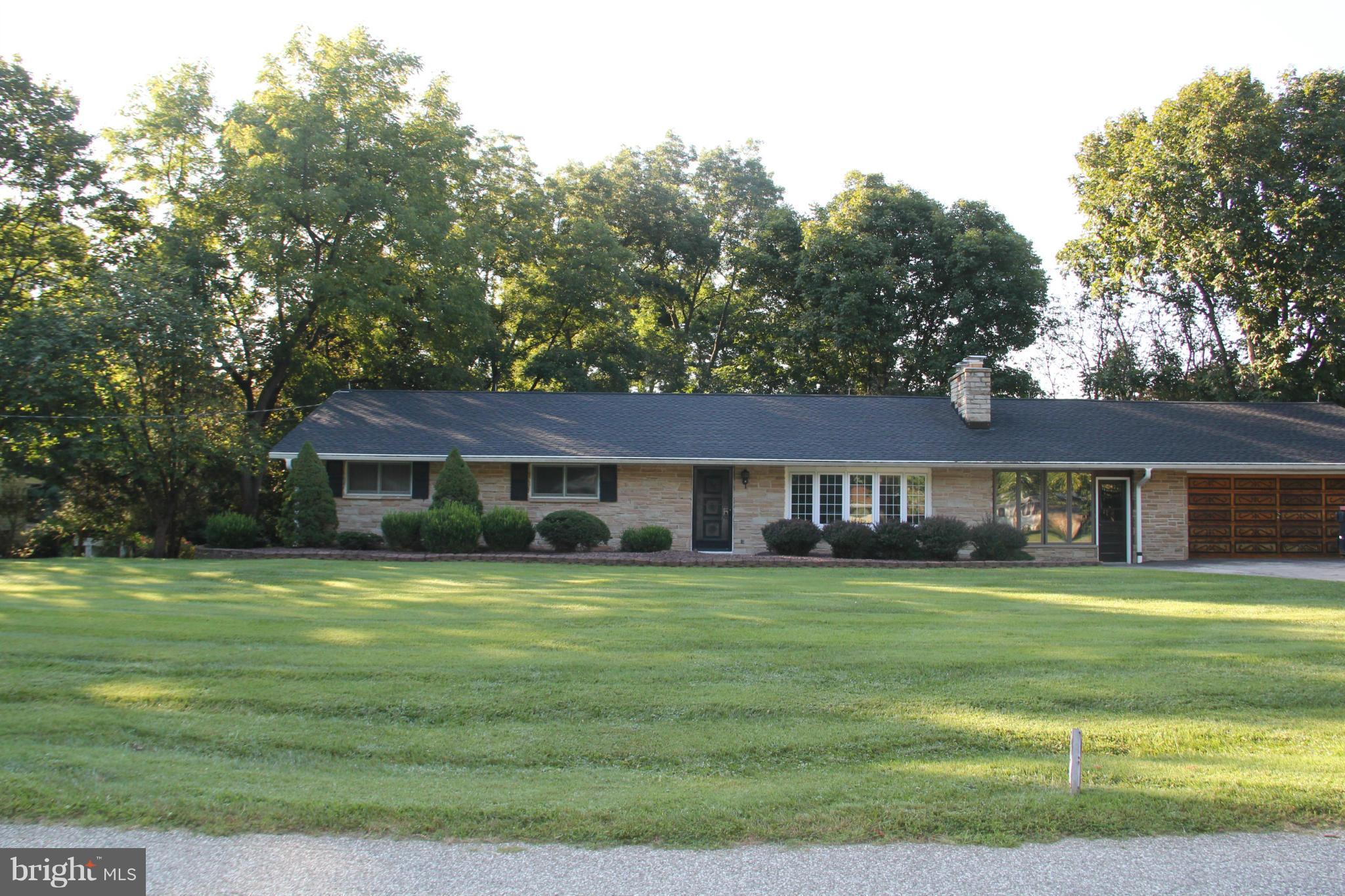 9913 Fox Hill Road Perry Hall, MD 21128 - Photo 2 of 24 a front view of a house with a yard