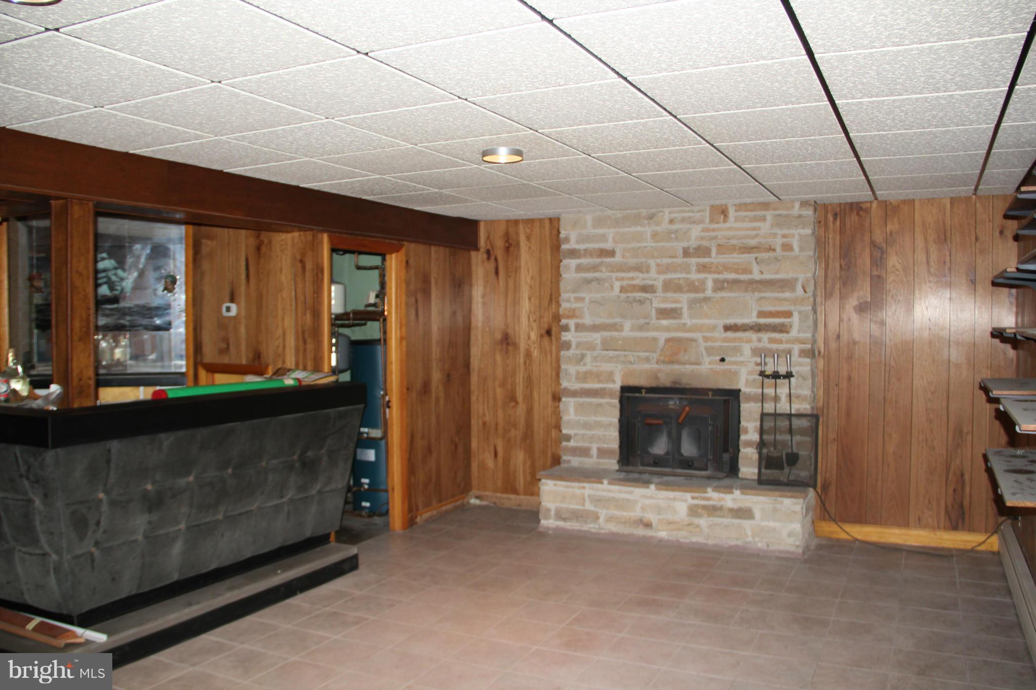 9913 Fox Hill Road Perry Hall, MD 21128 - Photo 18 of 24 a living room with furniture and a fireplace