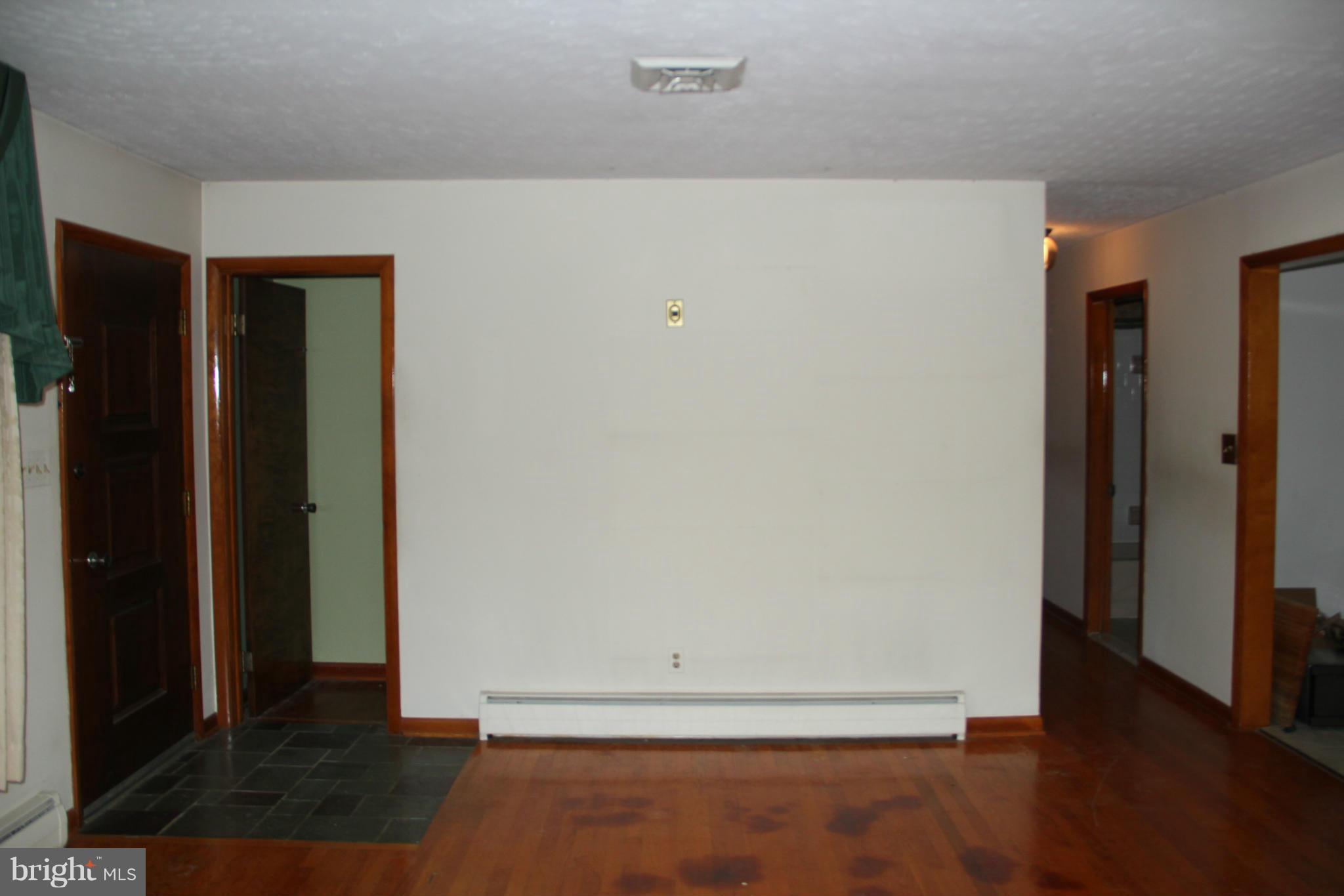 9913 Fox Hill Road Perry Hall, MD 21128 - Photo 8 of 24 an empty room with wooden floor