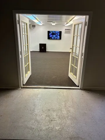 a view of a workspace with furniture