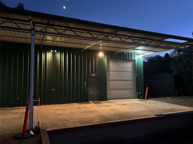 a view of a refrigerator in kitchen and wooden floor