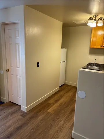 a kitchen with granite countertop a stove and a sink