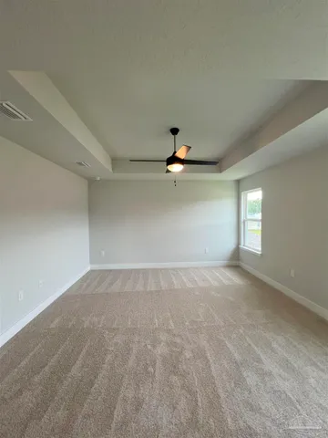 an empty room with a empty space and a window