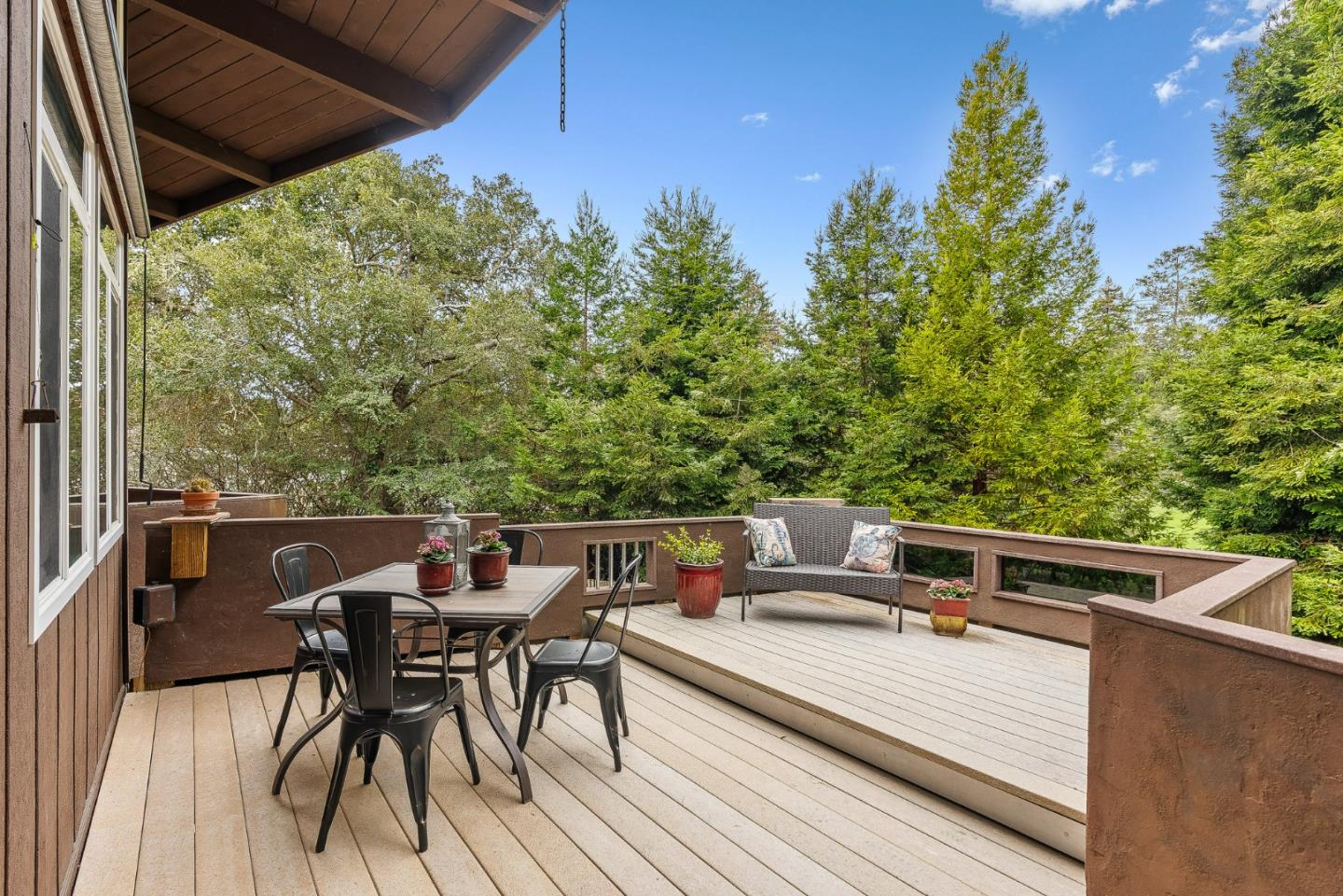 231 Aptos School Road Aptos, CA 95003 - Photo 15 of 49 a view of a roof deck with table and chairs and wooden floor