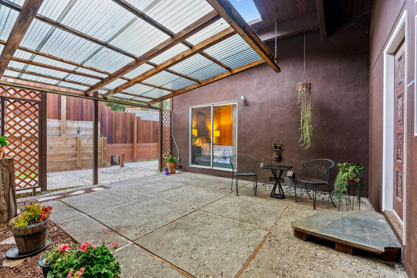 231 Aptos School Road Aptos, CA 95003 - Photo 2 of 49 a building outdoor space with patio furniture and potted plants