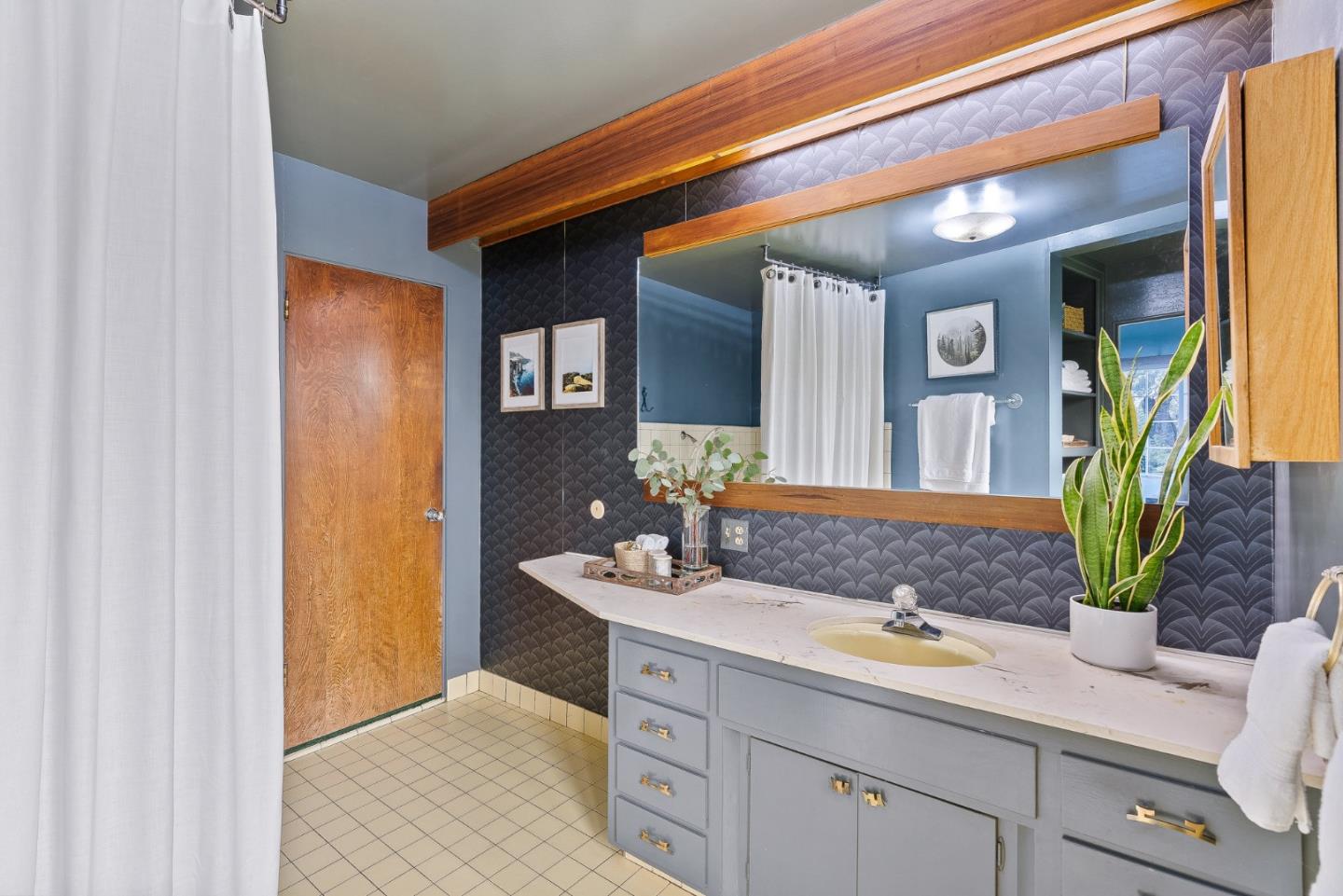 231 Aptos School Road Aptos, CA 95003 - Photo 25 of 49 a bathroom with a granite countertop sink and a mirror