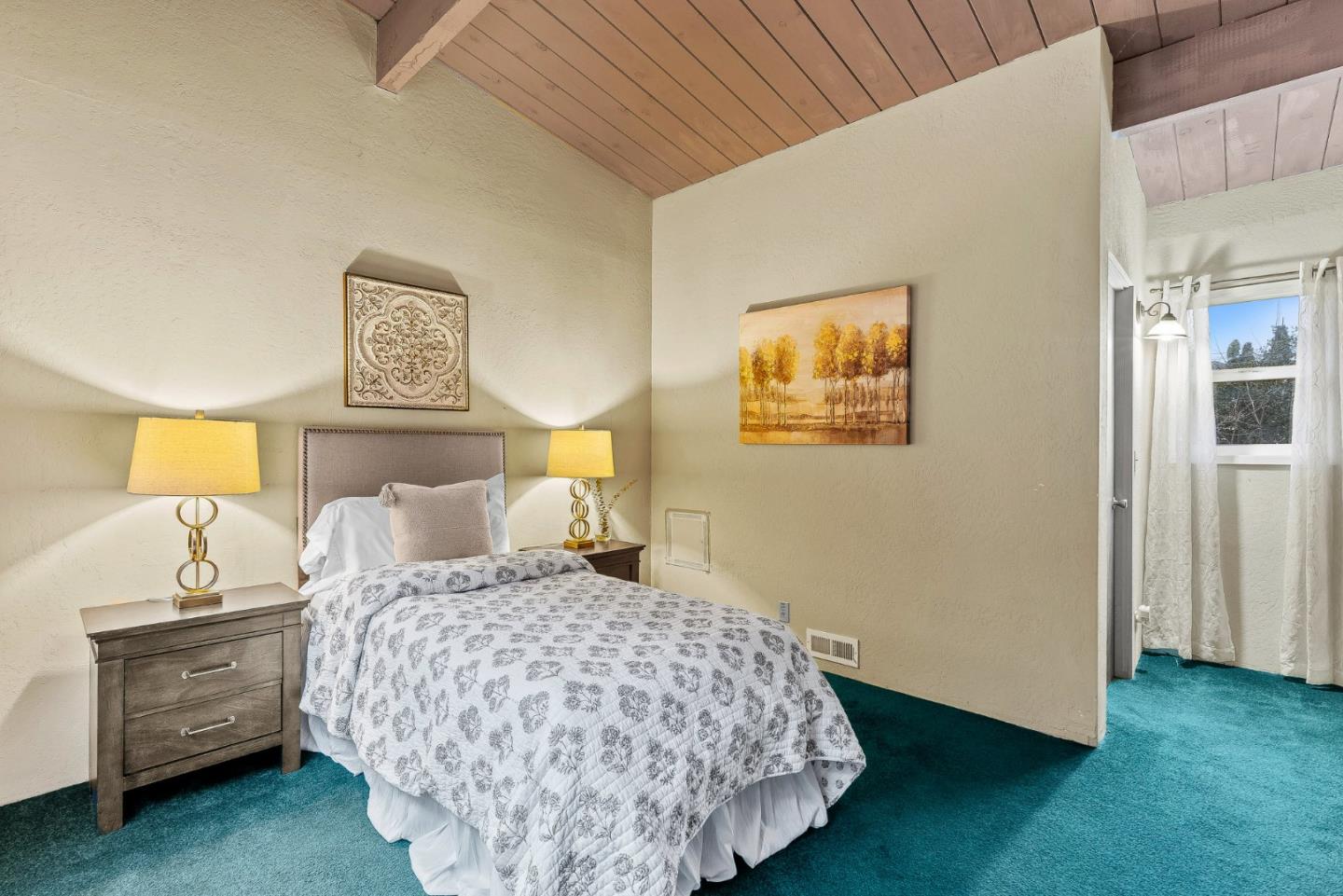 231 Aptos School Road Aptos, CA 95003 - Photo 26 of 49 a bedroom with a bed and a lamp