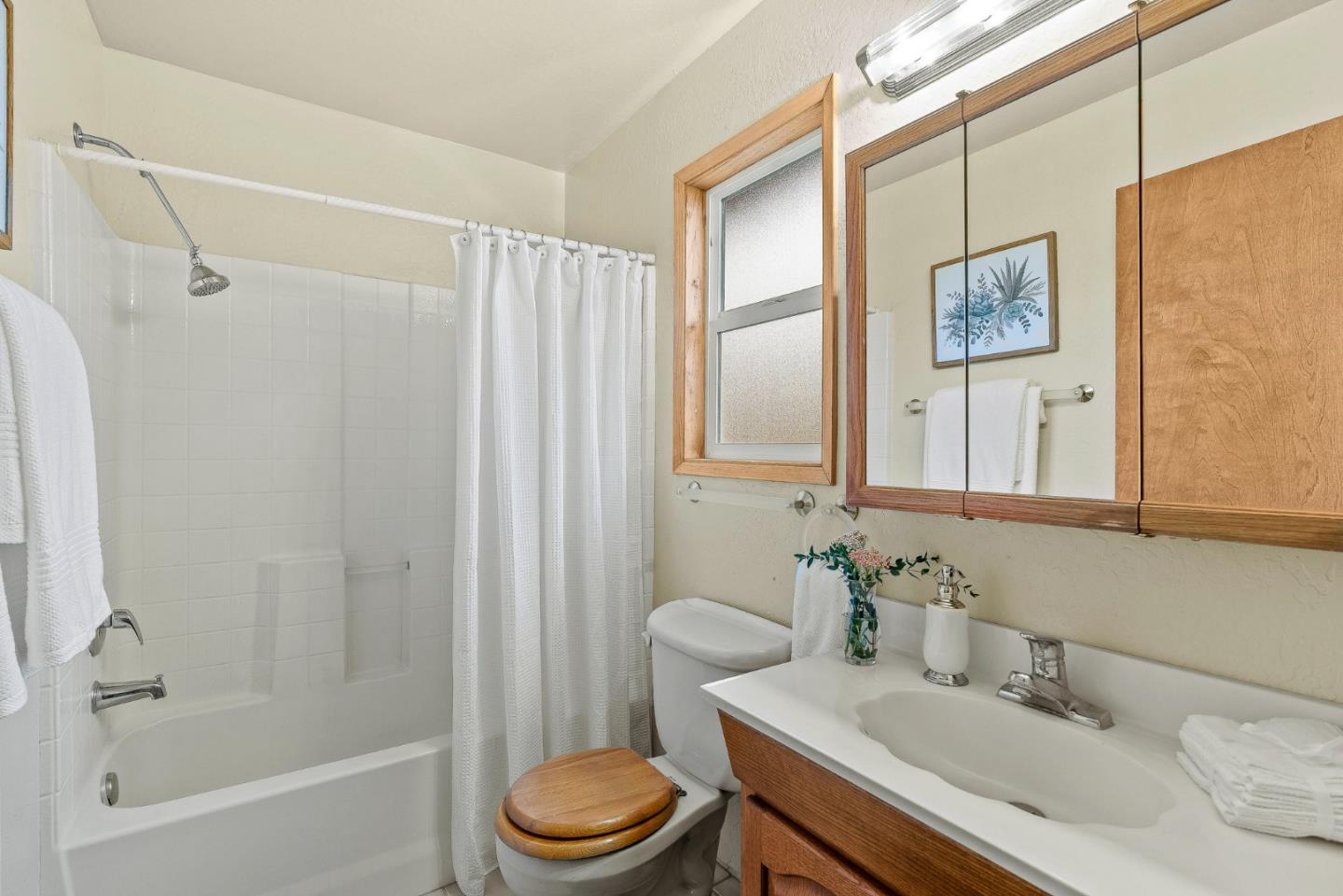 231 Aptos School Road Aptos, CA 95003 - Photo 27 of 49 a bathroom with a sink a toilet and shower