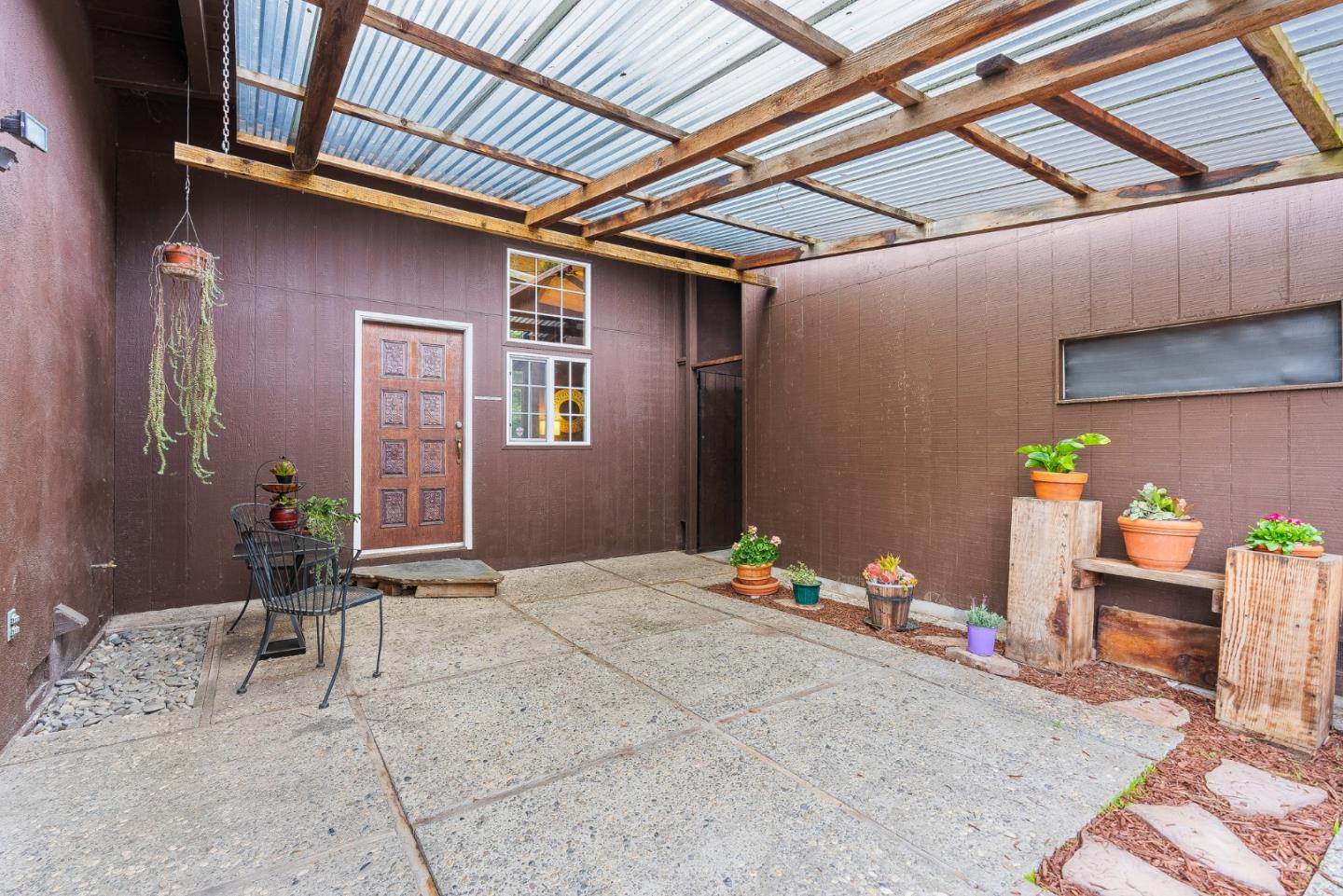 231 Aptos School Road Aptos, CA 95003 - Photo 3 of 49 a bedroom with a bed and a table