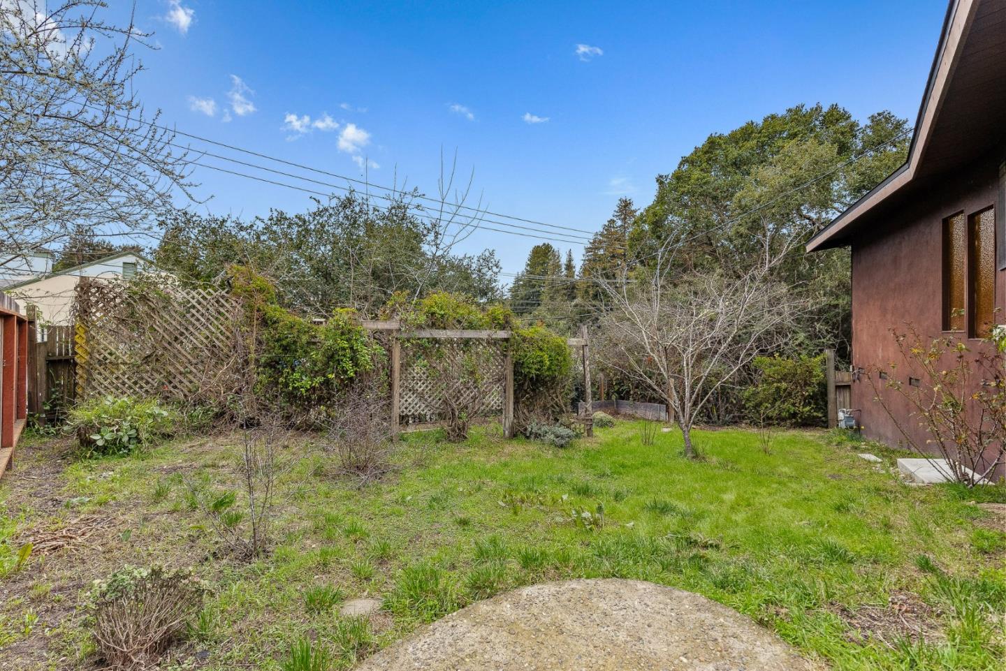 231 Aptos School Road Aptos, CA 95003 - Photo 32 of 49 a backyard of a house with lots of green space