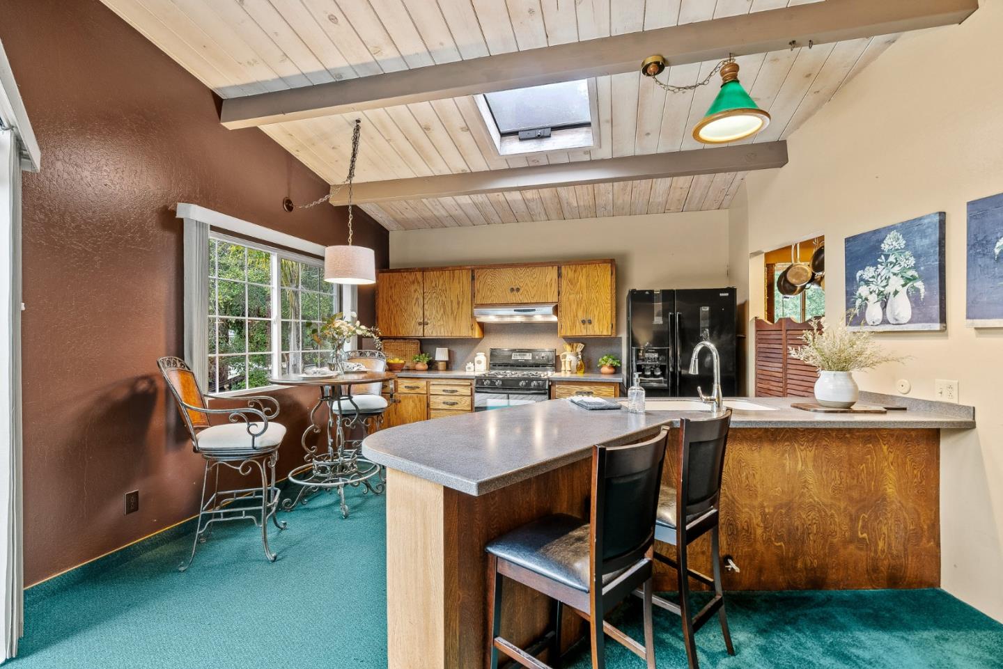 231 Aptos School Road Aptos, CA 95003 - Photo 9 of 49 a dining hall with stainless steel appliances granite countertop a stove and a dining table with the kitchen view