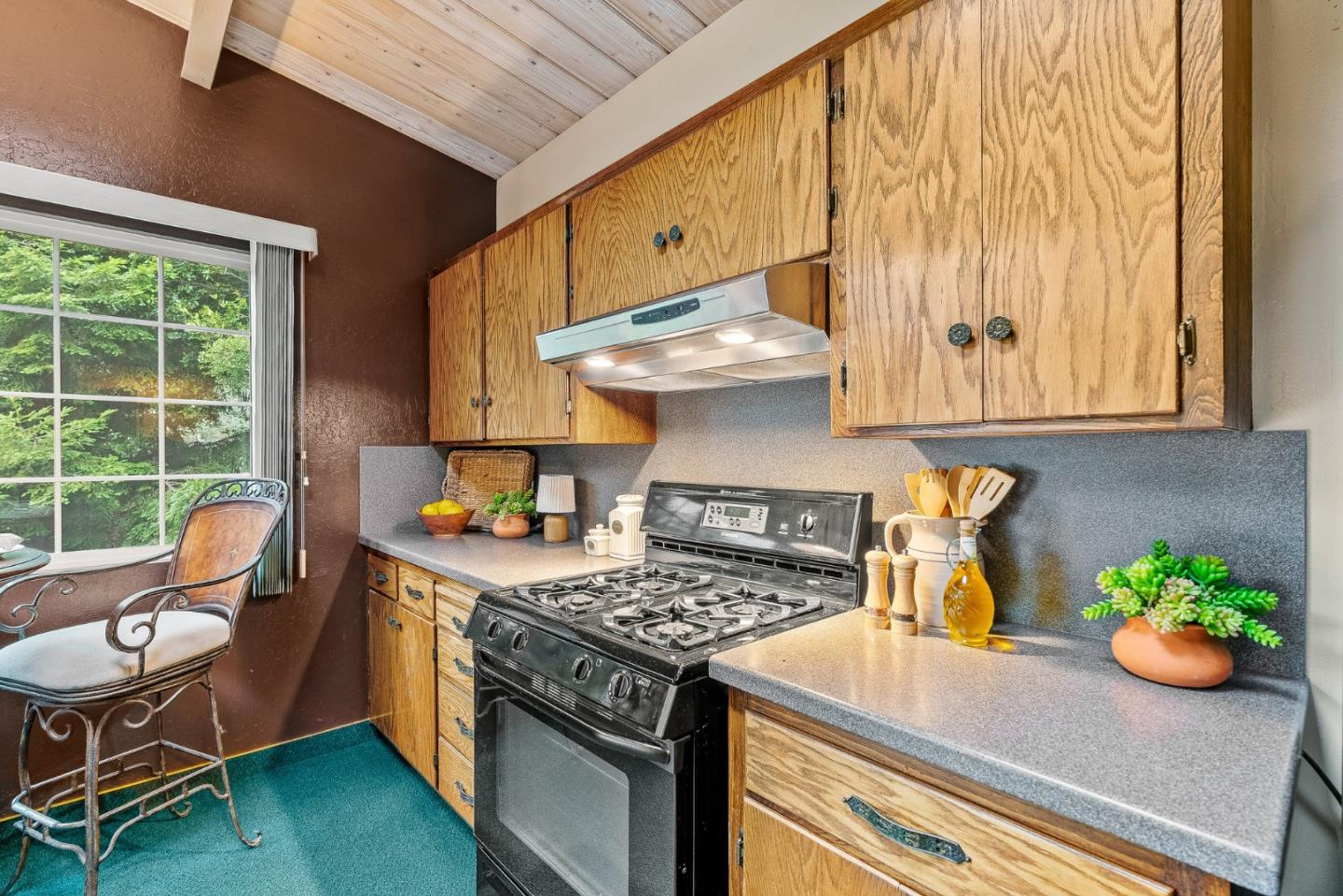 231 Aptos School Road Aptos, CA 95003 - Photo 10 of 49 a kitchen with granite countertop a stove a sink and a microwave