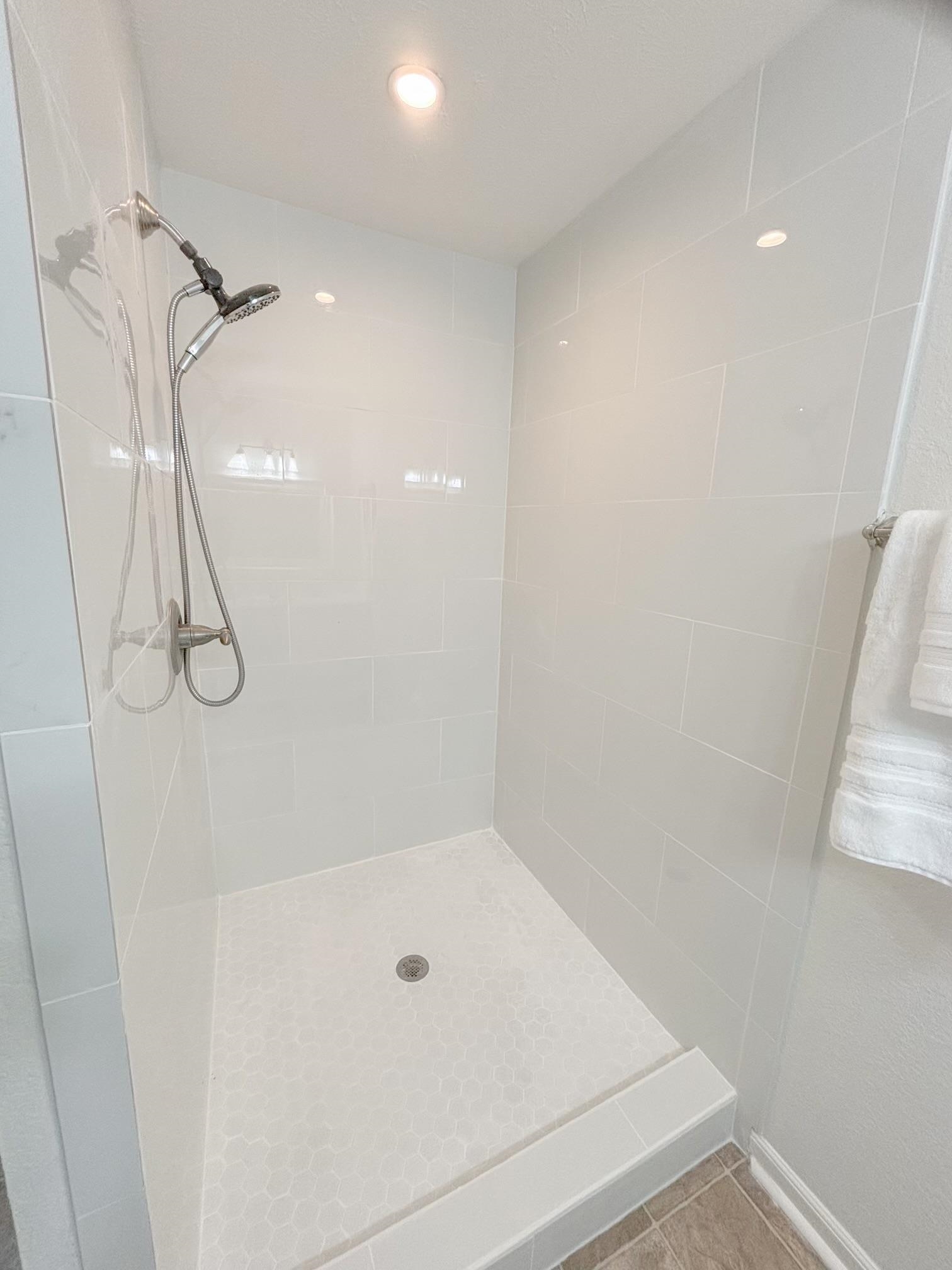 1695 Dawson Road Brighton, TN 38011 - Photo 12 of 13 Bathroom with tiled shower and tile patterned floors