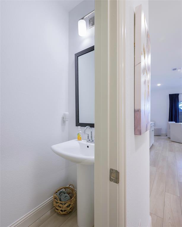 1311 Union Road Celina, TX 75009 - Photo 13 of 38 a bathroom with a sink and a mirror