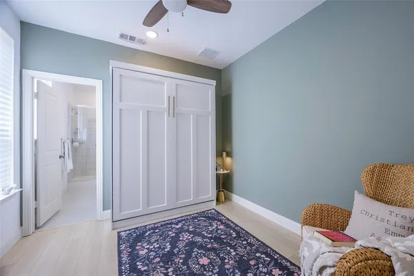 a room with furniture and a wooden floor