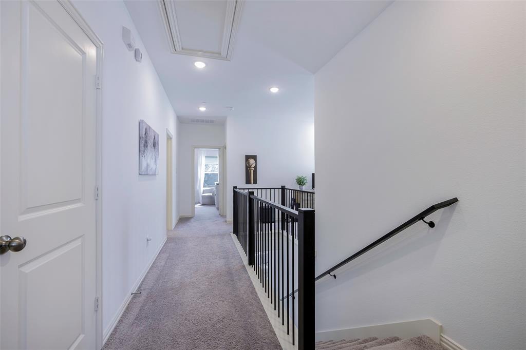 1311 Union Road Celina, TX 75009 - Photo 19 of 38 a view of a hallway with a chandelier